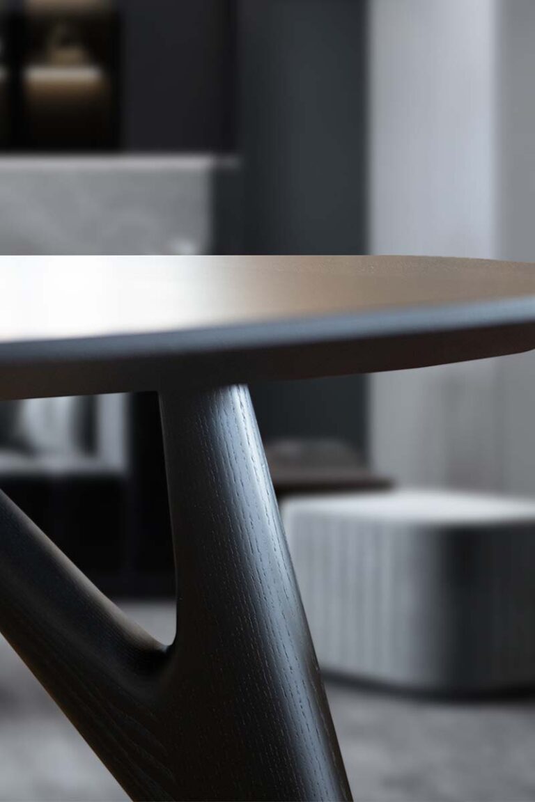 Ted Ash total black dining table with a sleek, minimalist design and solid wooden structure.