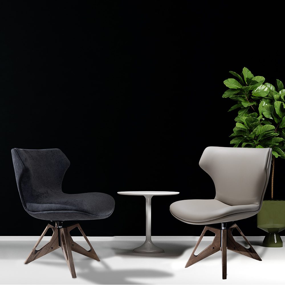 Le poltrone Aurora e Bruno posizionate insieme in un interno moderno, con rivestimenti lussuosi e un design raffinato.