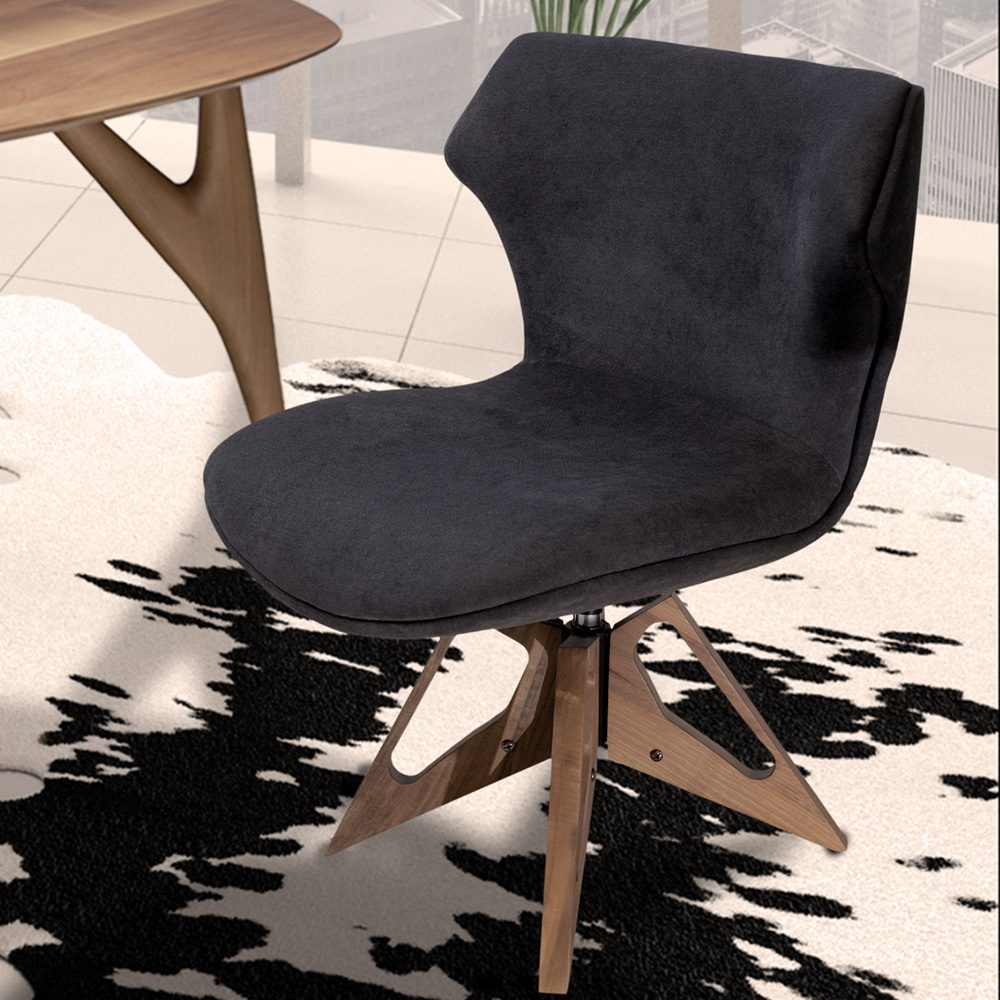 La poltrona Bruno abbinata a un tavolo moderno e raffinato, che esprime un’armoniosa combinazione tra design e funzionalità.