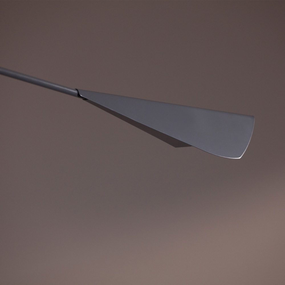 A modern Calla ceiling lamp featuring sleek design with elegant curves, providing beautiful illumination to a contemporary living space.