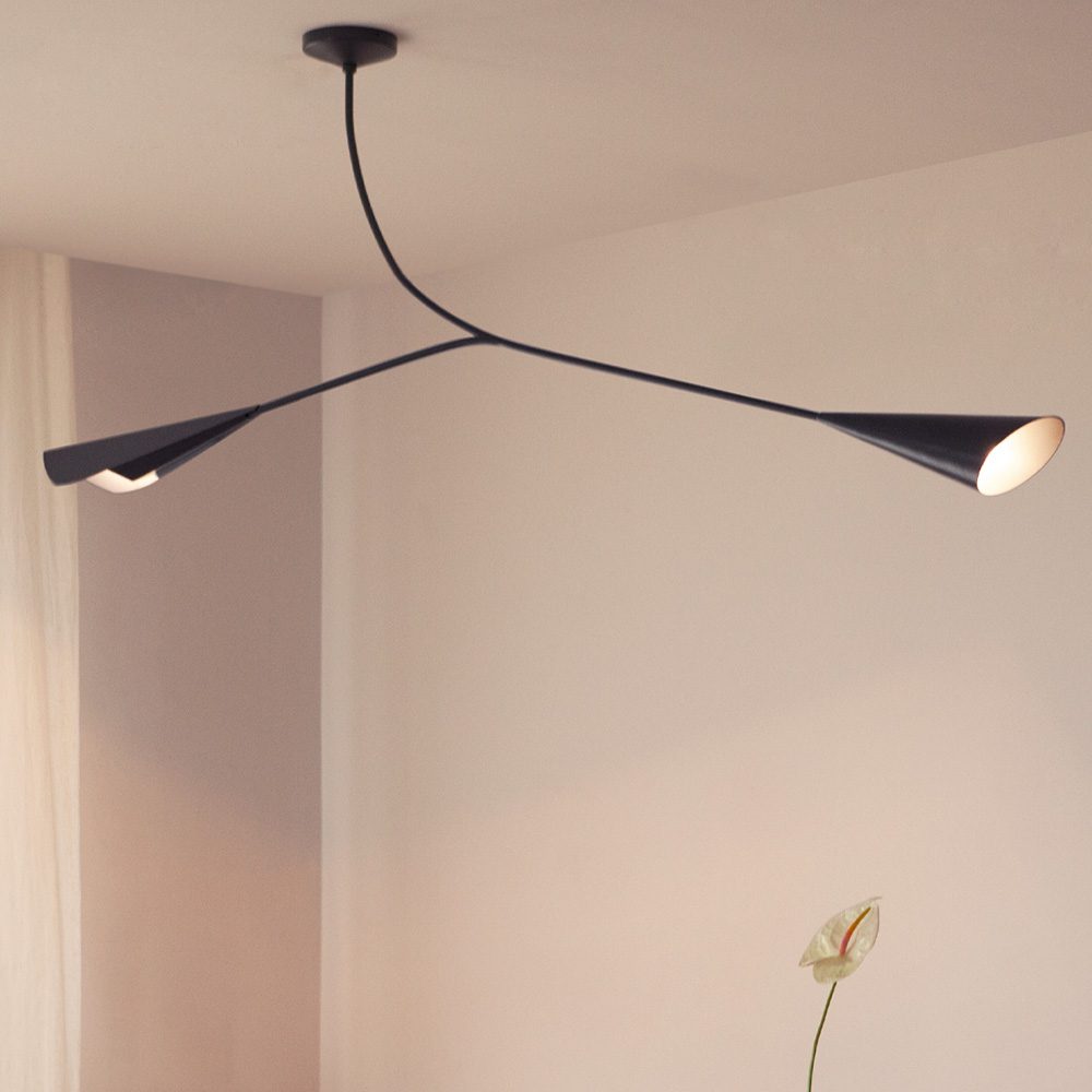 A refined, lamp design, Calla ceiling light showcasing a minimalist design with soft curves and an elegant finish, designed to brighten up modern interiors.